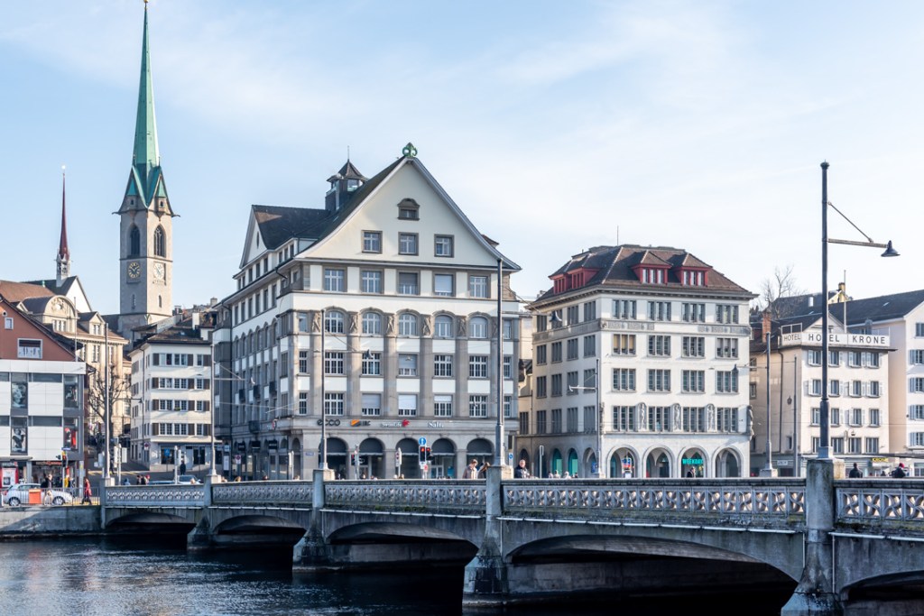 A bridge and historical buildings on the riverside in Zurich, Switzerland.